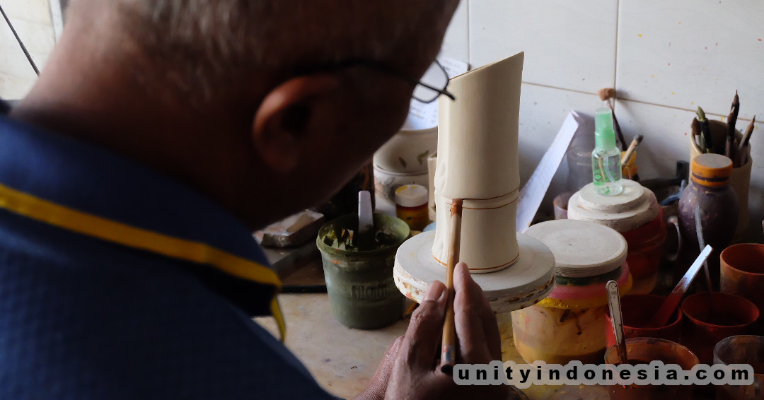 Indonesian ceramic, artisan making bamboo container.