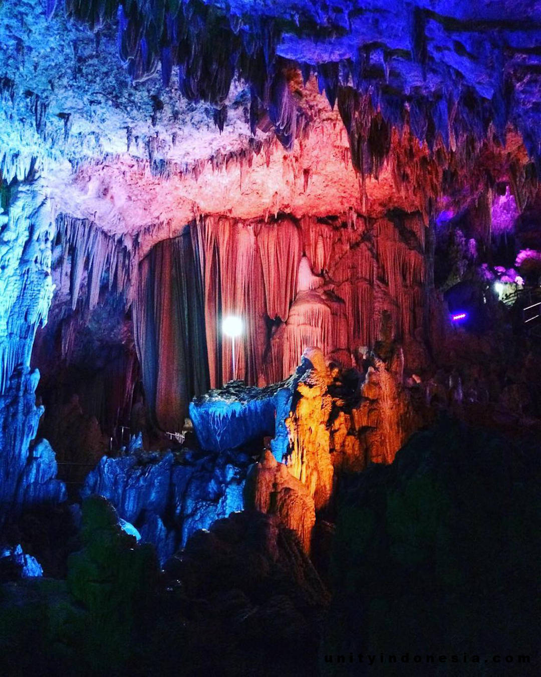 Stalactites and stalagmites in the Gong Cave: spectacular colourful lighting. Courtesy of Muhammad Bima Sakti: @muhammadbimasakti